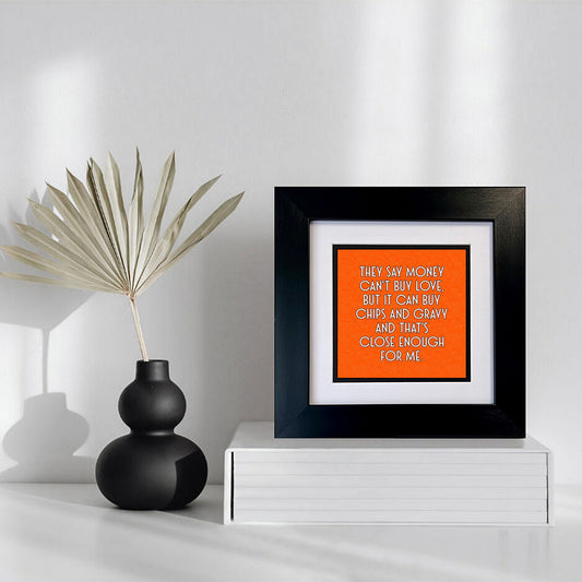 MONEY CAN'T BUY LOVE FRAMED PRINT ON ORANGE BACKGROUND