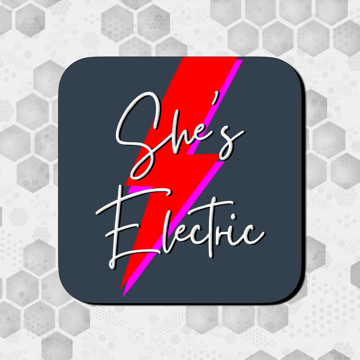 A square coaster with a gloss finish, featuring the text 'She's Electric' with a red lightning bolt design on a dark background. OASIS LYRICS