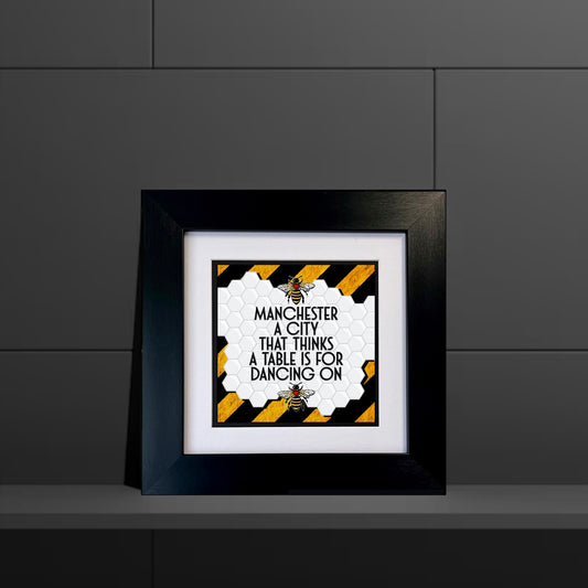 MANCHESTER A CITY THAT THINKS A TABLE IS FOR DANCING ON FRAMED PRINT STRIPE BACKGROUND