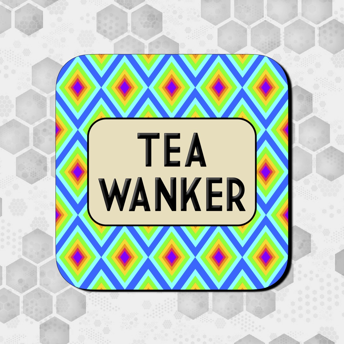 A colorful square coaster with a geometric pattern and the text 'TEA WANKER' in bold letters.