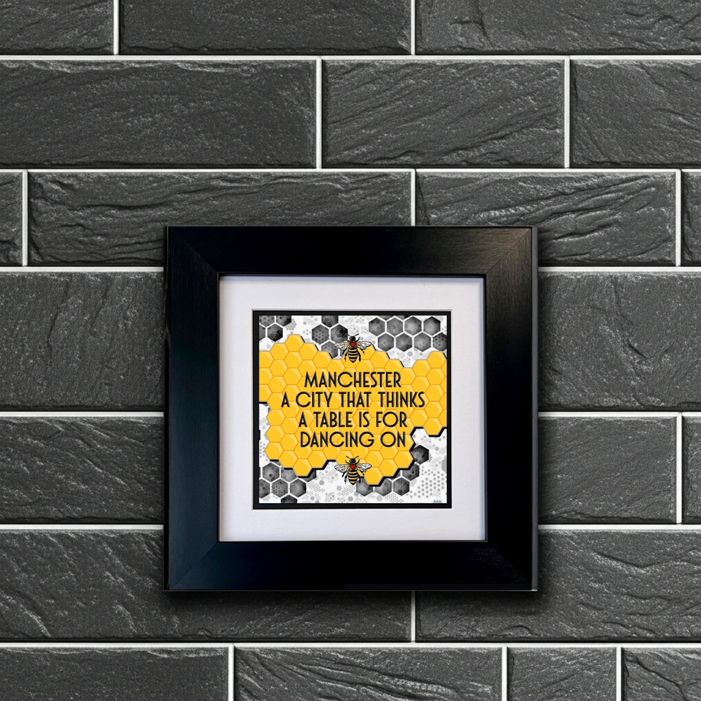 MANCHESTER A CITY THAT THINKS A TABLE IS FOR DANCING ON FRAMED PRINT