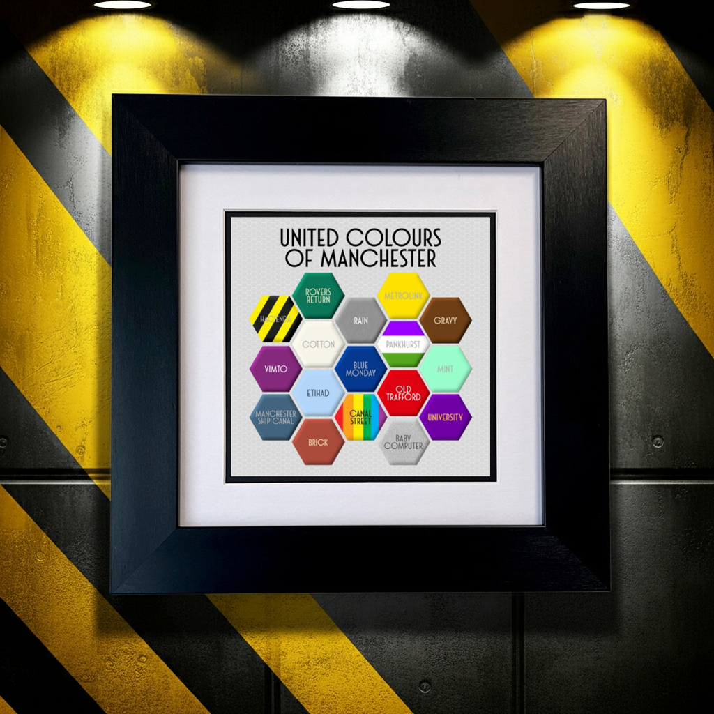 A colourful FRAMED print titled 'UNITED COLOURS OF MANCHESTER', featuring a honeycomb pattern with different colours and text elements representing various aspects of Manchester. SU MACE GIFTS