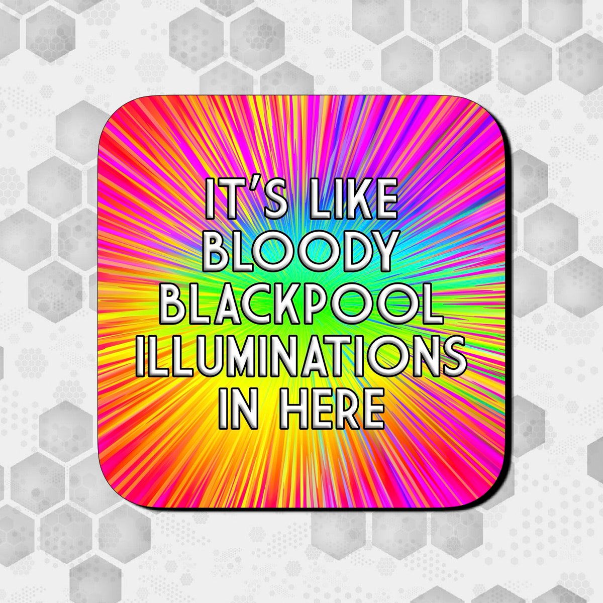Coaster with a bright rainbow burst background radiating from the center, featuring bold text that reads ‘It’s like bloody Blackpool illuminations in here