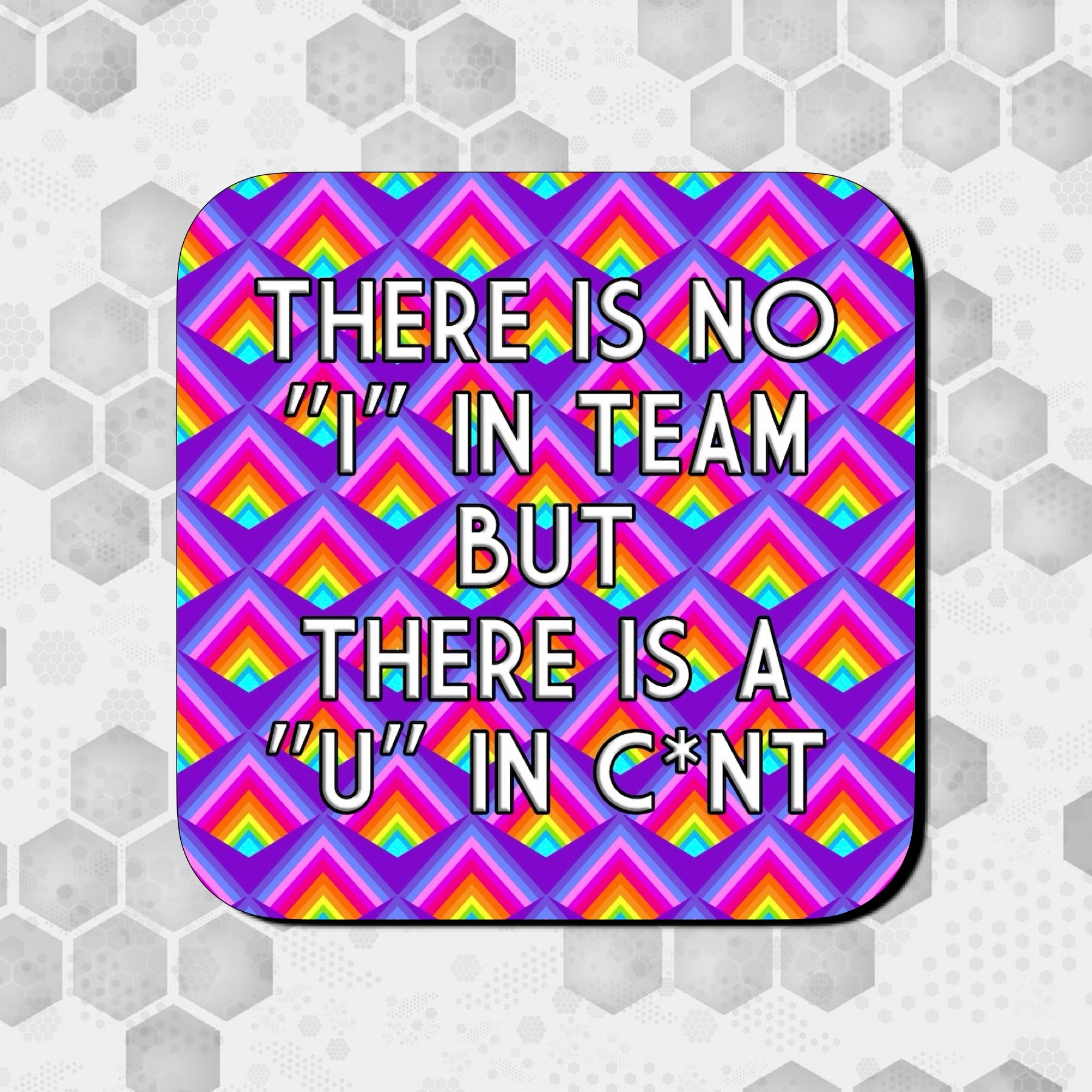 Coaster with a bold geometric rainbow pattern on a purple background, featuring large centered text that reads ‘There is no “I” in team but there is a “U” in c*nt