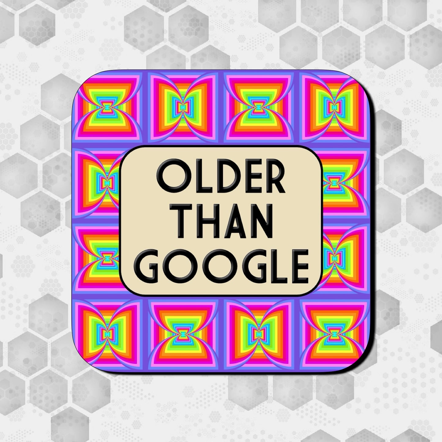 Coaster with a bright retro rainbow geometric pattern in the background, featuring a rounded beige box at the center with bold black text reading ‘Older Than Google.