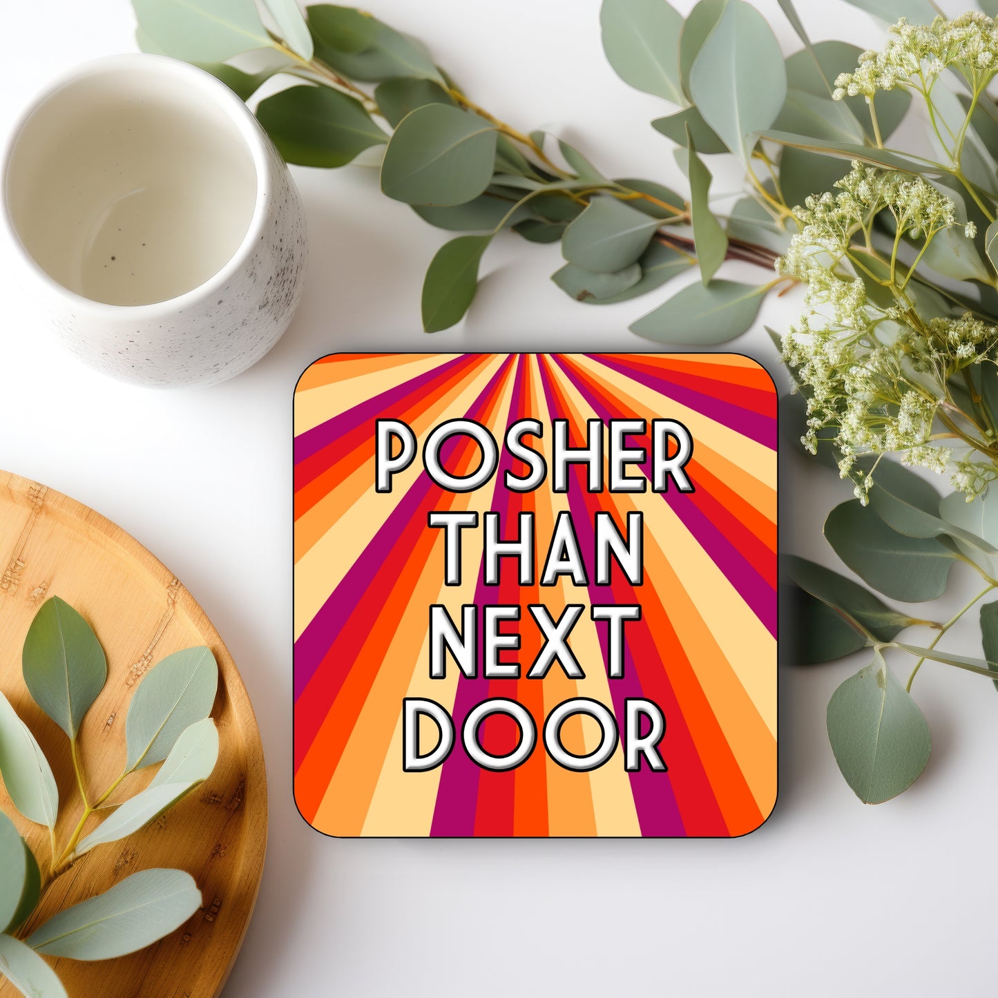 A square coaster with a multicolored STRIPE design and text 'POSHER THAN NEXT DOOR' 