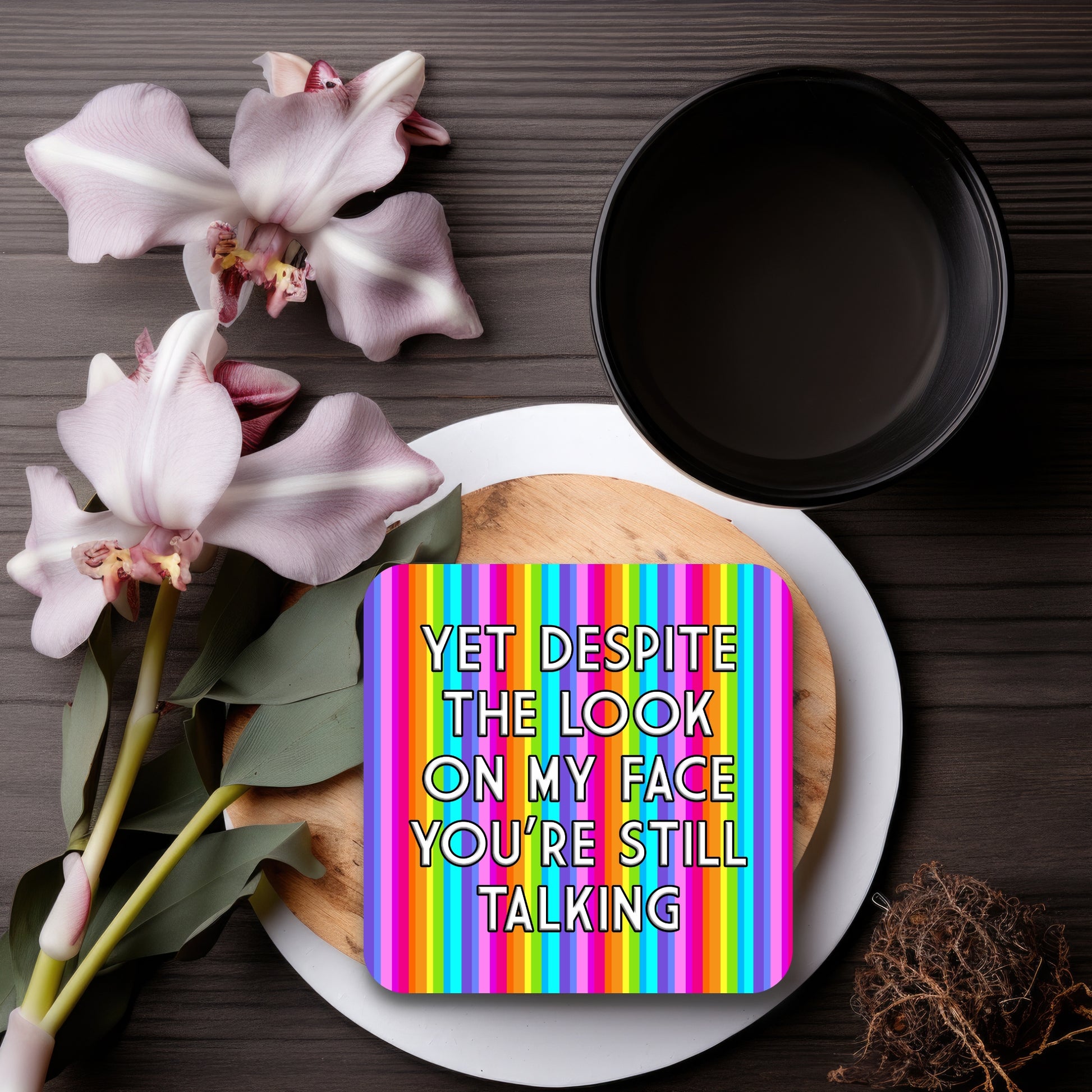 DESPITE THE LOOK ON MY FACE YOU'RE STILL TALKING COASTER WITH A RAINBOW COLOUR STRIPE BACKGROUND