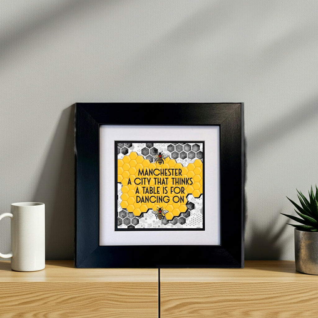 MANCHESTER A CITY THAT THINKS A TABLE IS FOR DANCING ON FRAMED PRINT