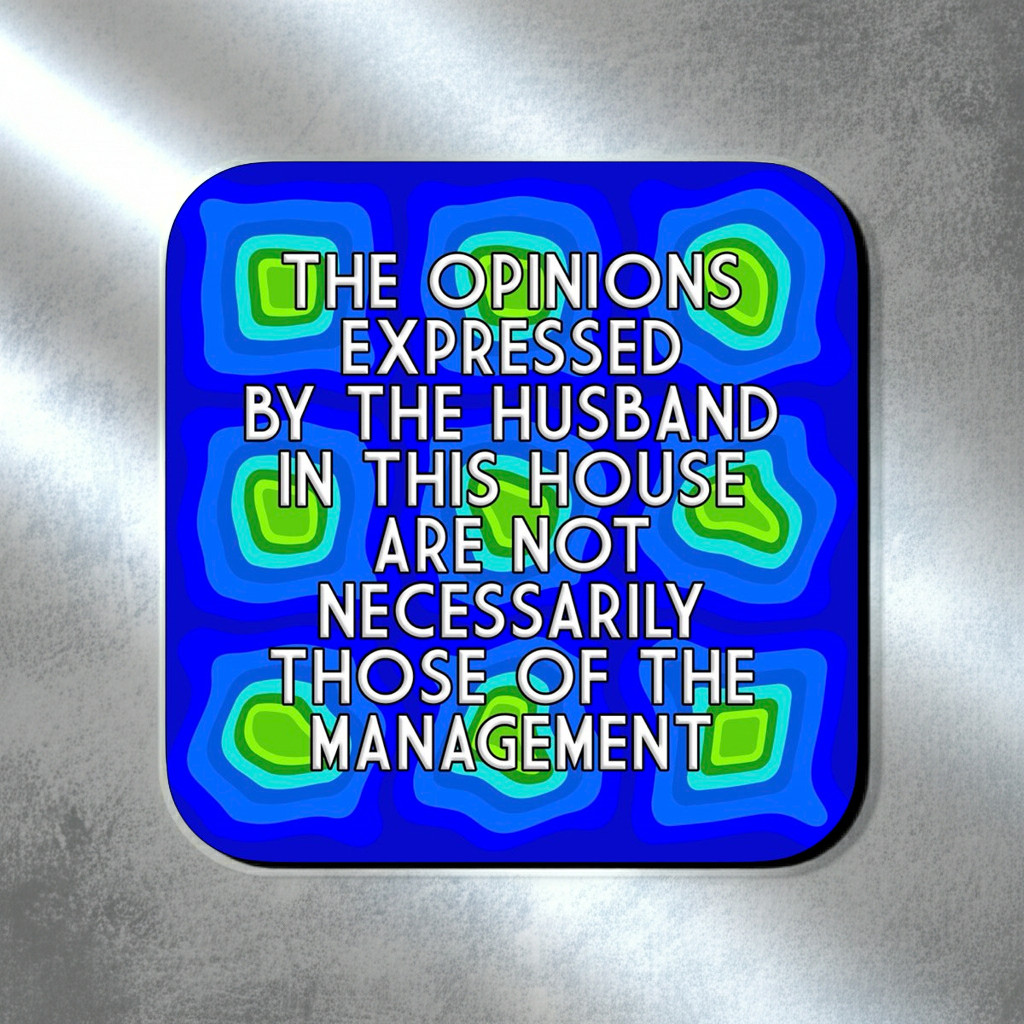Coaster with a blue abstract layered pattern featuring green and teal geometric shapes, overlaid with bold centered text that reads ‘The opinions expressed by the husband in this house are not necessarily those of the management