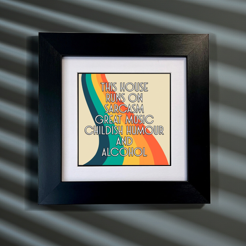Framed artwork with colorful text on a striped background