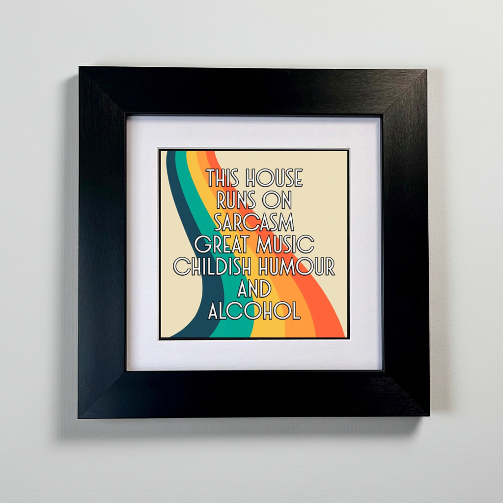 Framed artwork with colorful design and text on a gray background